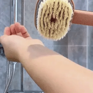 Brosse de massage et bain à manche long
