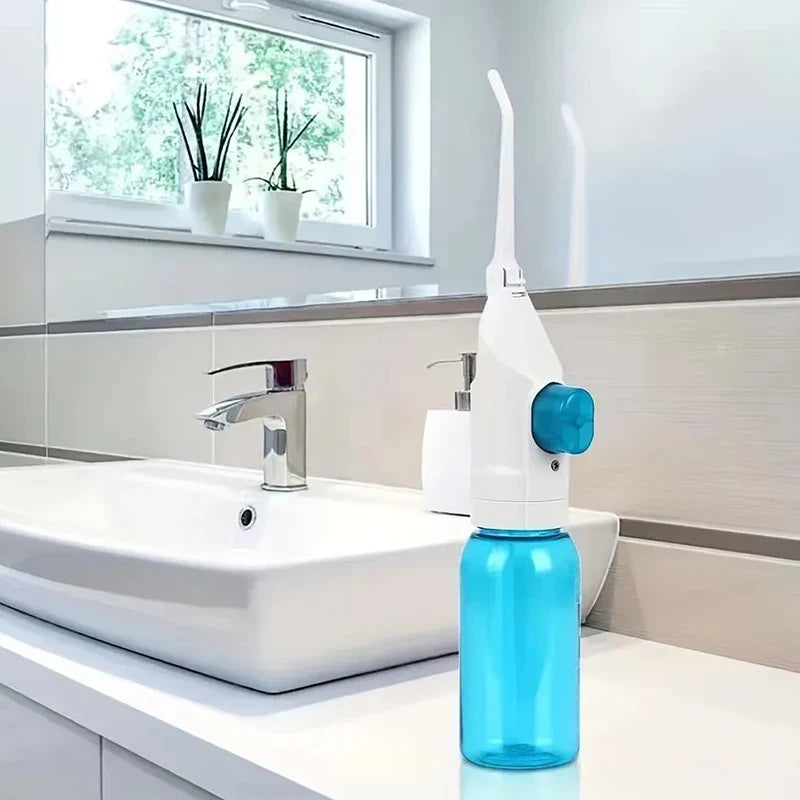 Irrigateur dentaire manuel portable